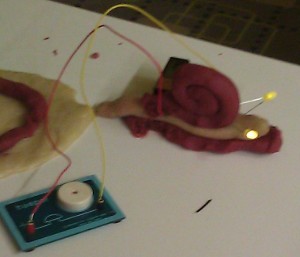 Snail with LEDs made of conductive dough